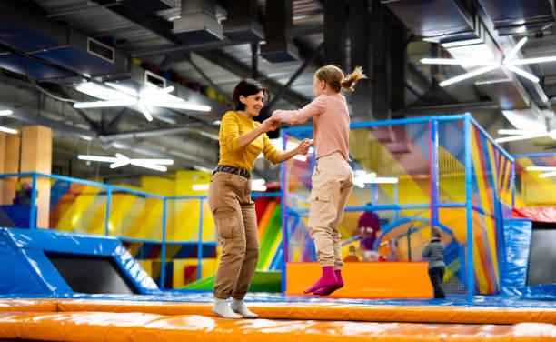 Families enjoying attractions inside an indoor entertainment venue